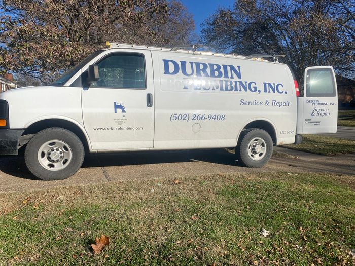 White Durbin Plumbing, Inc. service van with (502) 266-9408 lettered on the side