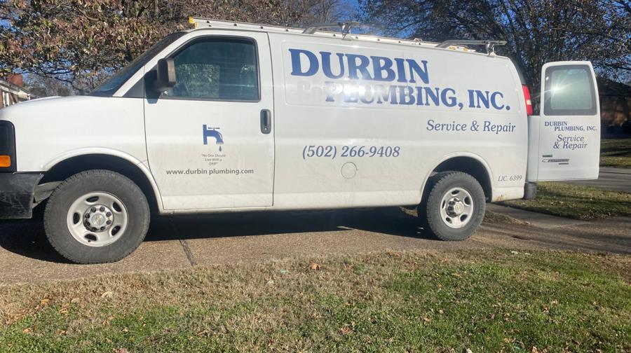 White Durbin Plumbing, Inc. service van with (502) 266-9408 lettered on the side