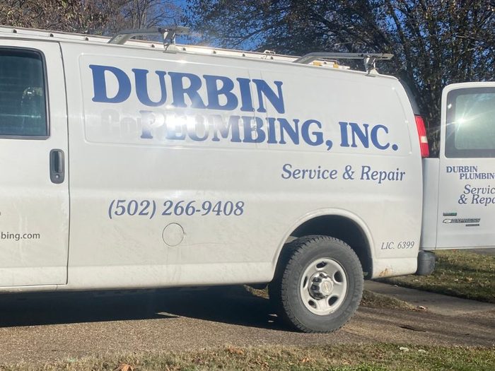 Durbin Plumbing, Inc. lettering and phone number on the side of the company van